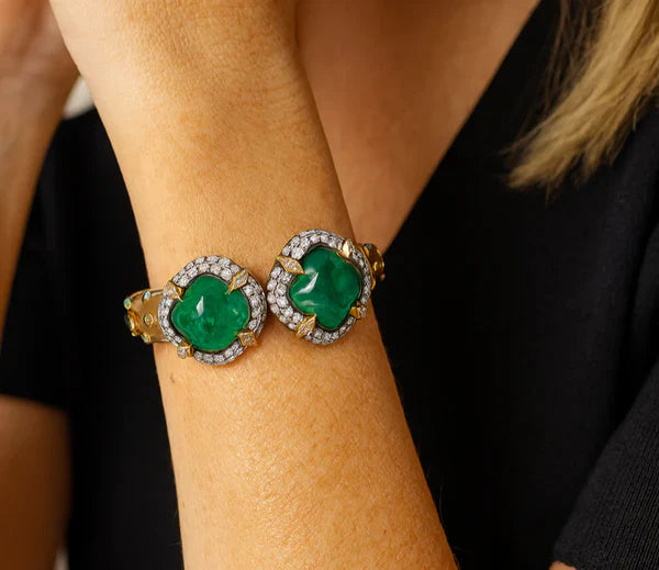 Two cabochon emerald and diamond cluster bracelets worn on the wrist, G Marie Luxuries Virginia Beach emerald jewelry collection