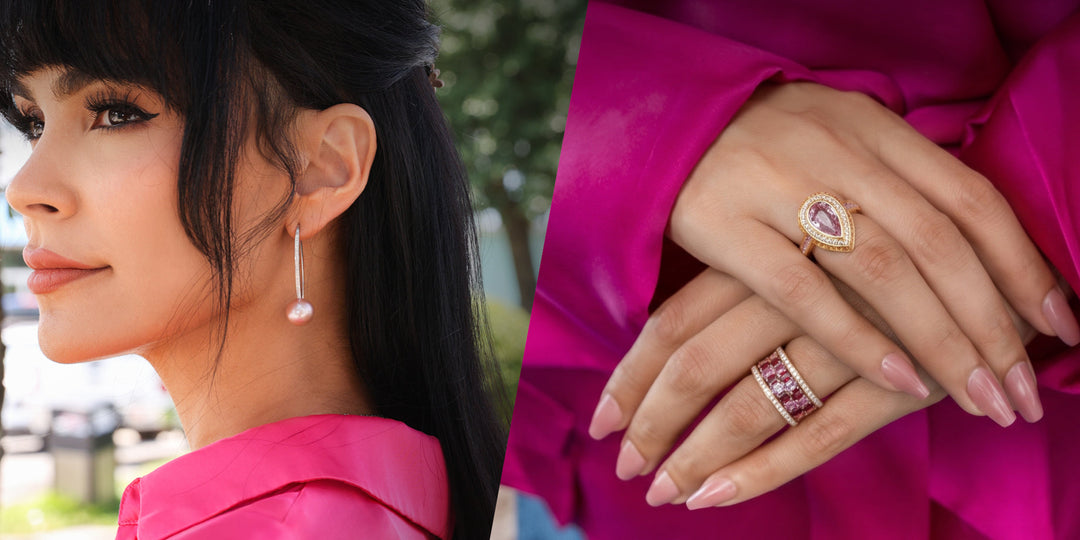 Woman wearing pink pearl drop earrings and layered pink gemstone rings, dressed in a vibrant magenta outfit.