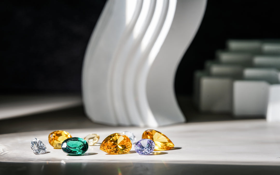 Different gemstones on a white surface. Birthstone concept.