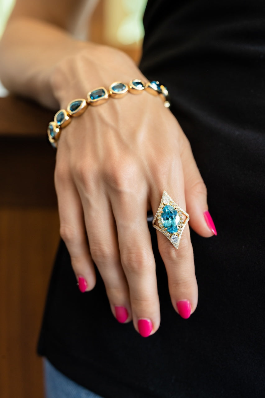 18k-yellow-gold-and-riviera-blue-zircon-bracelet-by-erica-courtney-model